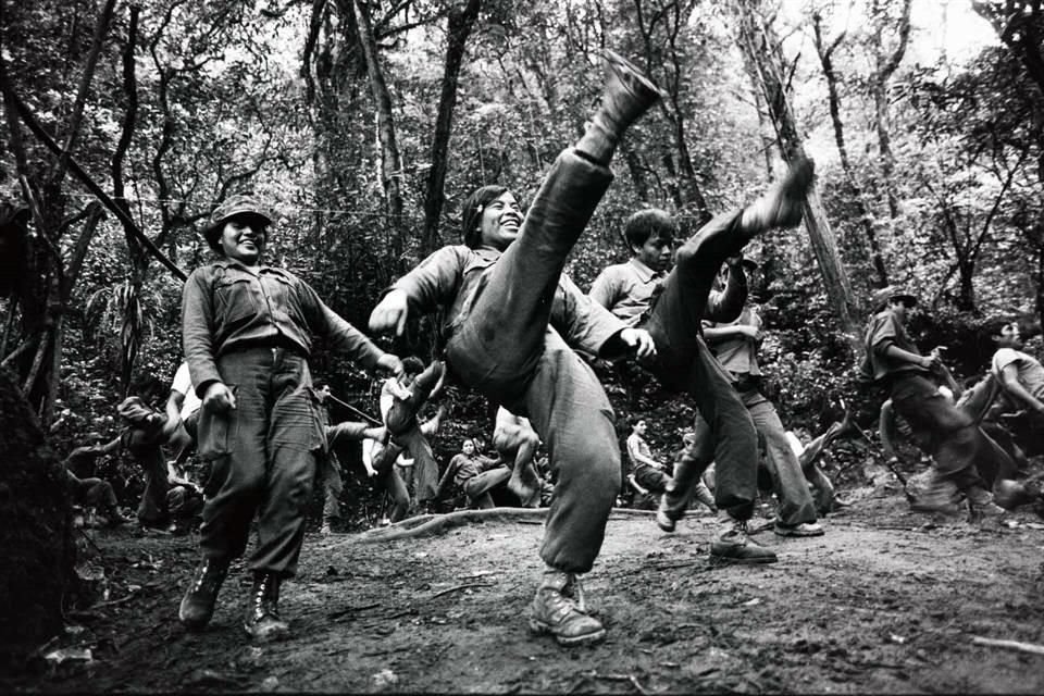 'Return to the Land of the Quetzal' documents the armed movement that took place in Guatemala in the early 1980s; above these lines, 'Training (1982)'.