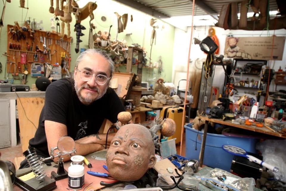 Miguel Ángel Gutiérrez in his studio, where pieces and tools for designing people and stories dominate the space.
